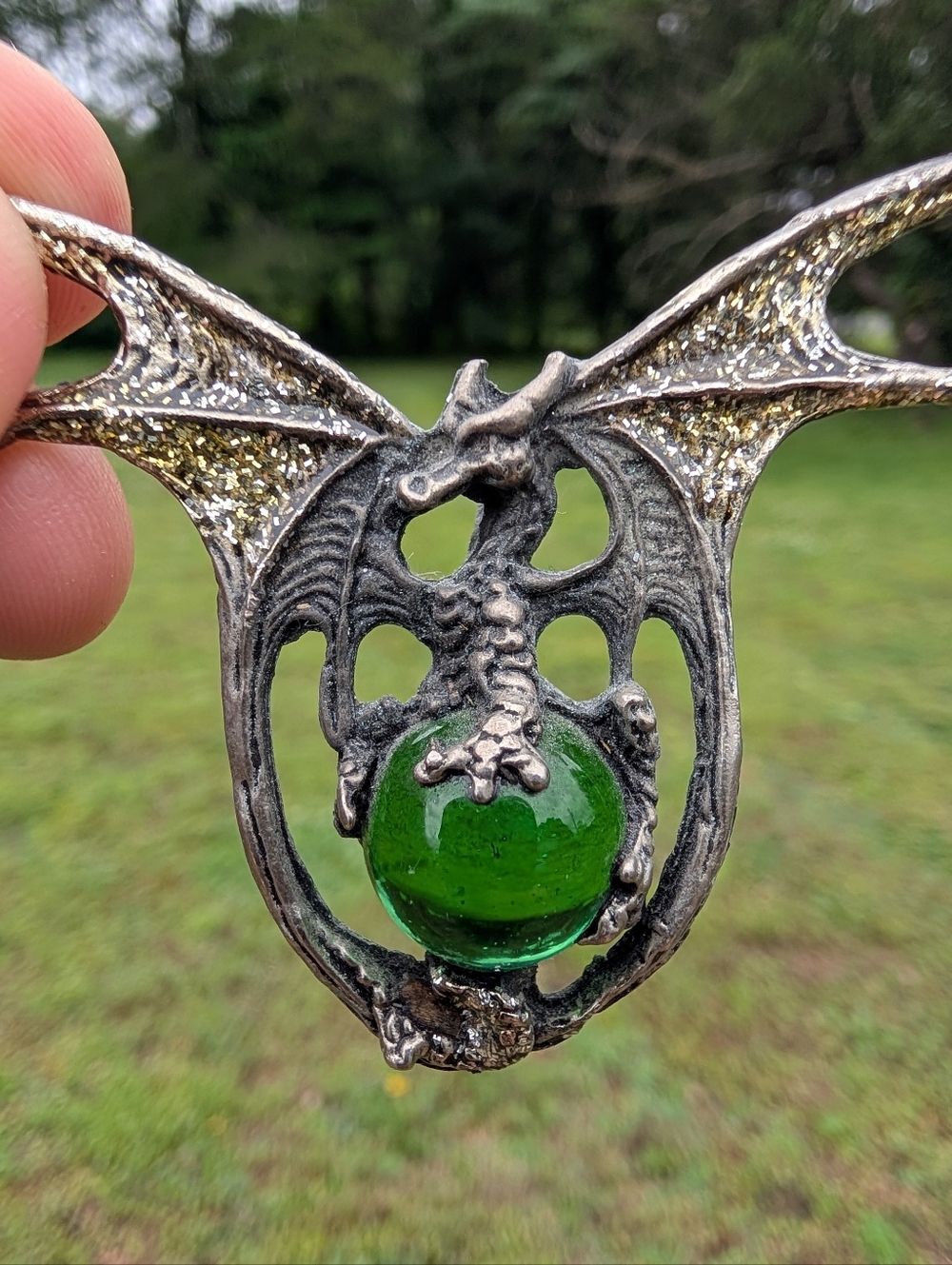 Pewter Dragon Pendant with Green Glass Orb And Gold Glitter Wings.